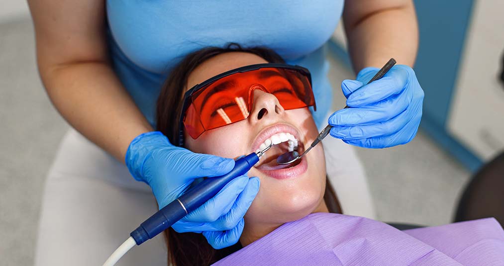 woman getting a dental cleaning