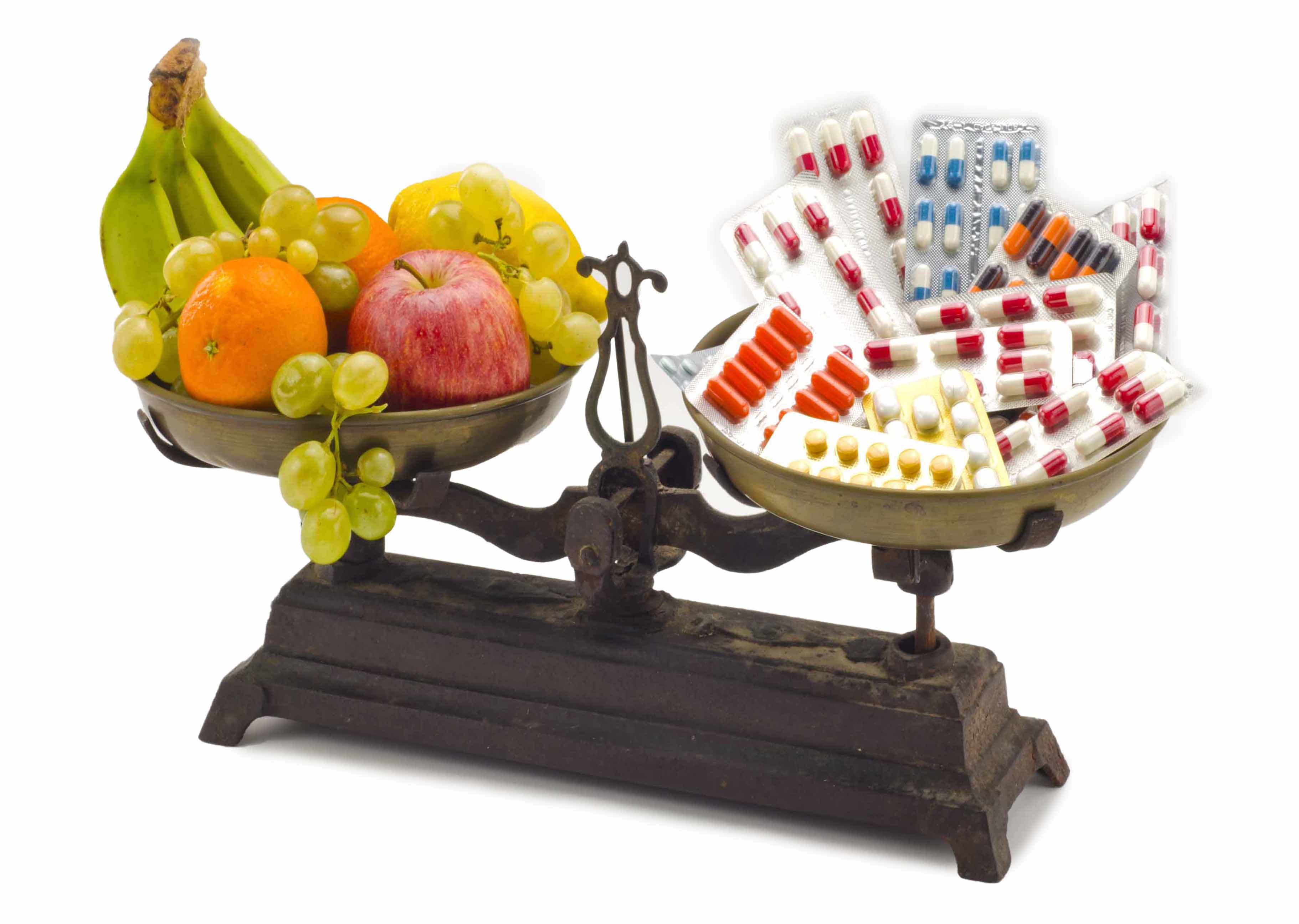 A bowl of food and a bowl of vitamins on a balance scale