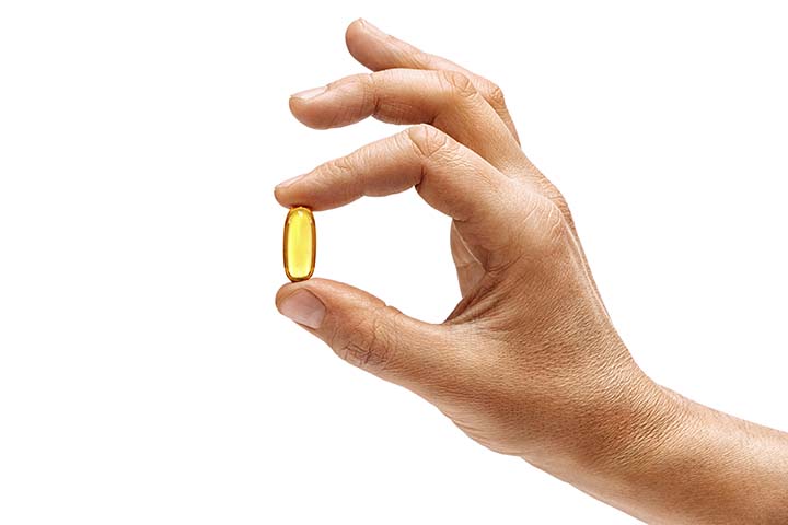 liquid gel pill held between two fingers
